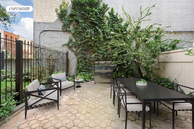 425 Convent Ave, New York City, NY 10031 - view of patio / terrace with a fenced backyard, grilling area, and outdoor dining area