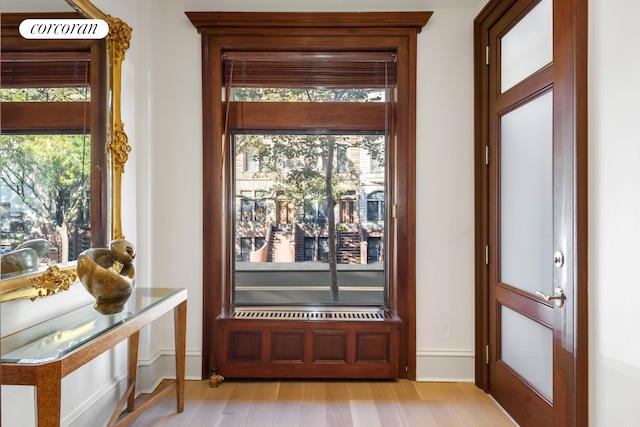 425 Convent Ave, New York City, NY 10031 - doorway with baseboards and light wood-style floors
