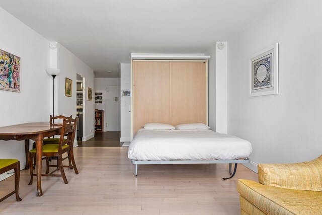 10 W 15th St Unit 927, New York City, NY 10011 - bedroom featuring a closet and light wood-style floors