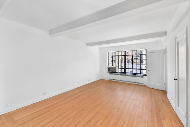 10 Park Ave Unit 9-E, New York City, NY 10016 - unfurnished room with beam ceiling, light wood-style flooring, radiator, cooling unit, and baseboards