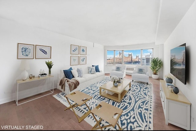 living area featuring wood finished floors and baseboards