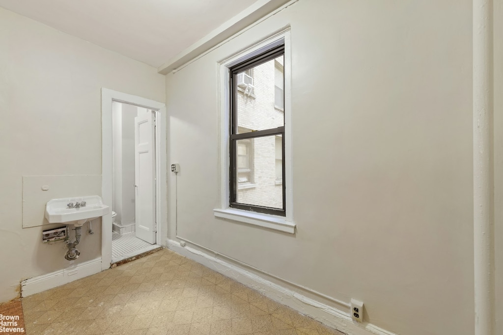 bathroom featuring tile patterned floors and baseboards