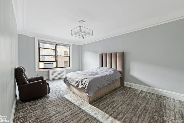 bedroom featuring a chandelier, crown molding, baseboards, and carpet floors