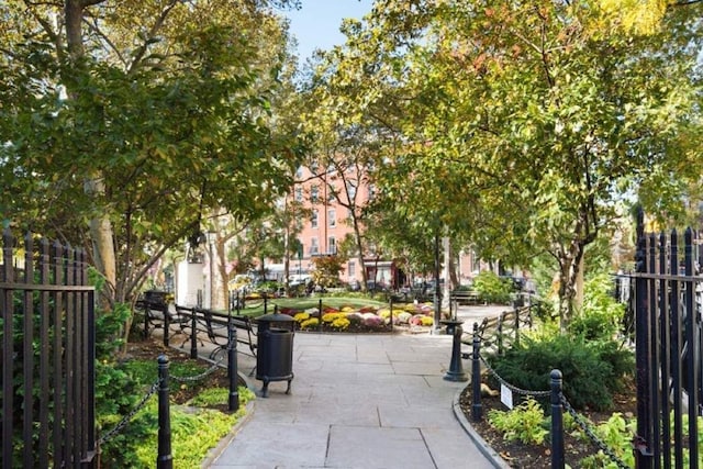 view of community featuring fence