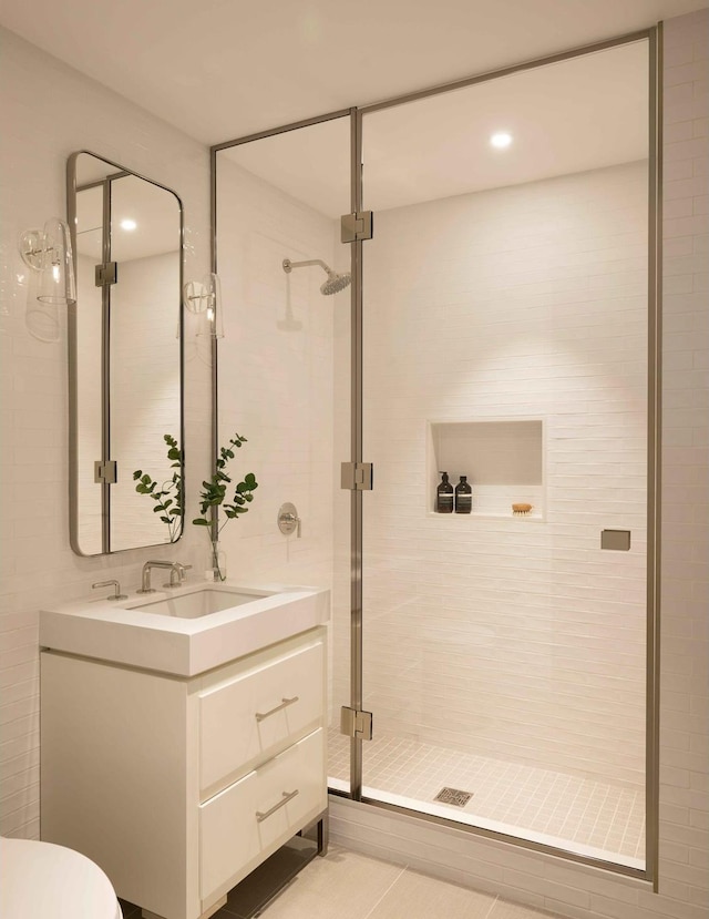 bathroom featuring a stall shower, vanity, toilet, and recessed lighting
