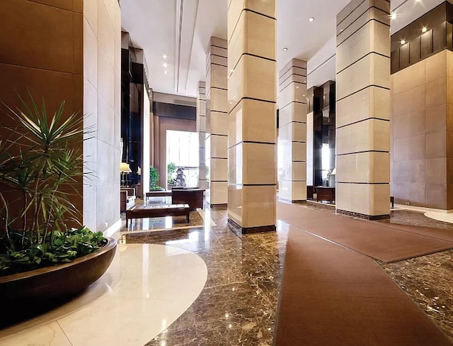 community lobby featuring a high ceiling