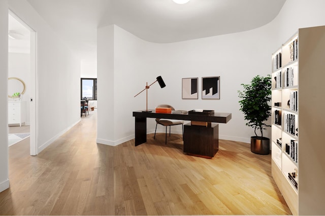 home office featuring light wood-style floors and baseboards