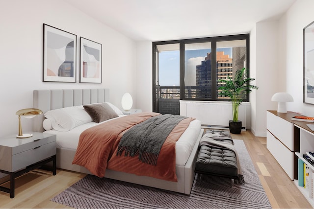 bedroom with light wood finished floors
