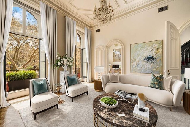243 E 17th St, New York City, NY 10003 - living area with a chandelier and ornamental molding