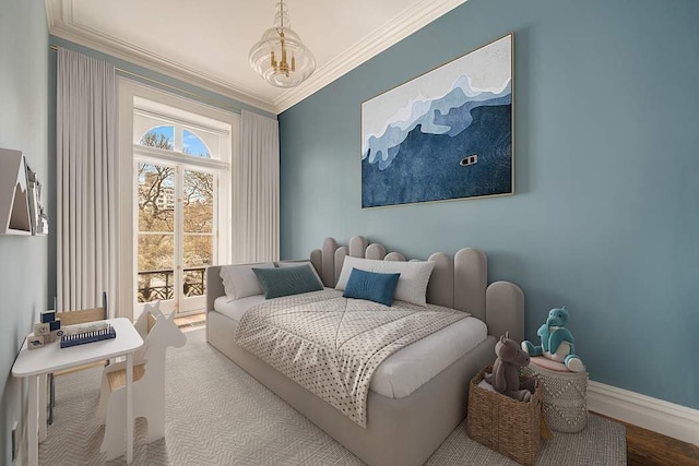 243 E 17th St, New York City, NY 10003 - bedroom featuring crown molding, baseboards, a chandelier, and wood finished floors