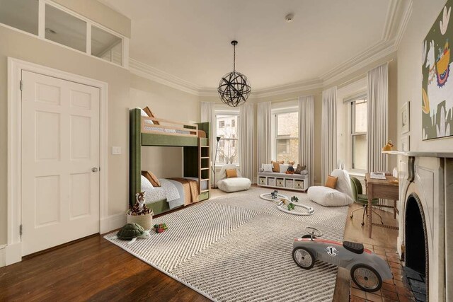 243 E 17th St, New York City, NY 10003 - bedroom featuring crown molding, wood finished floors, a chandelier, and baseboards