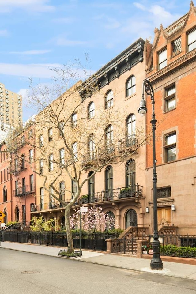 243 E 17th St, New York City, NY 10003 - view of apartment building / complex with fence