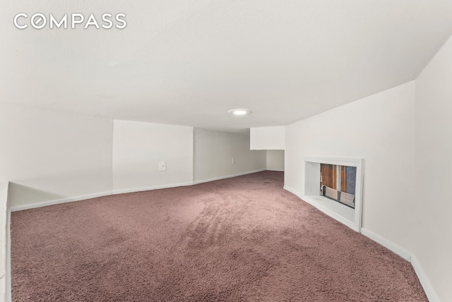 331 E 92nd St Unit 1A, New York City, NY 10128 - unfurnished living room with carpet flooring and a fireplace