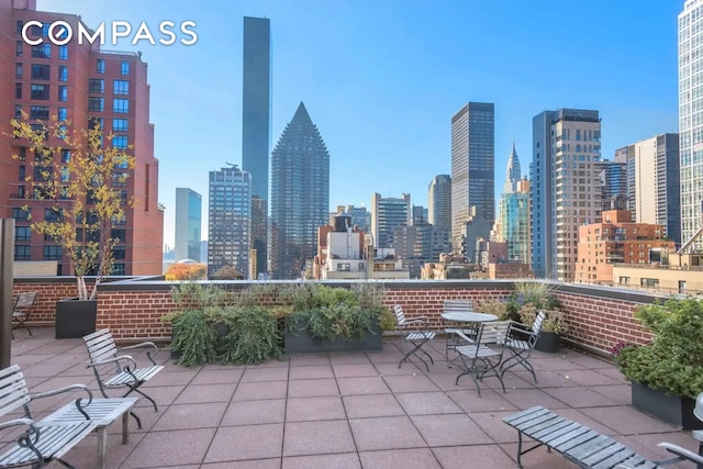 345 E 52nd St Unit 10Cd, New York City, NY 10022 - view of patio featuring a view of skyline