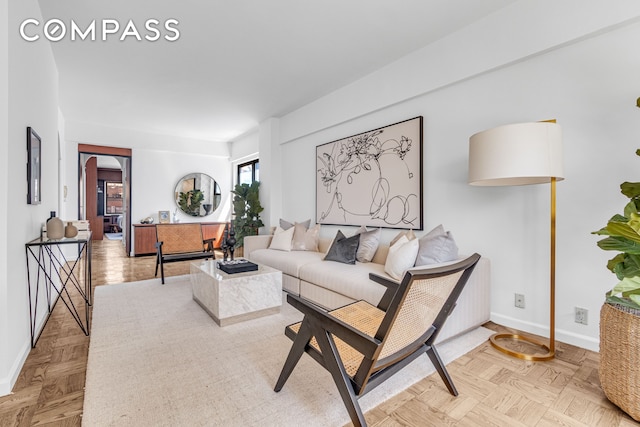 345 E 52nd St Unit 10Cd, New York City, NY 10022 - living room featuring baseboards