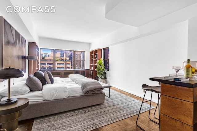345 E 52nd St Unit 10Cd, New York City, NY 10022 - bedroom featuring baseboards