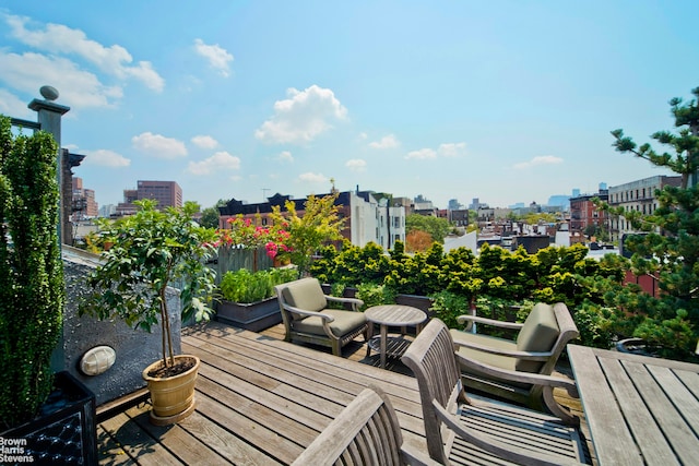 wooden terrace with a view of city