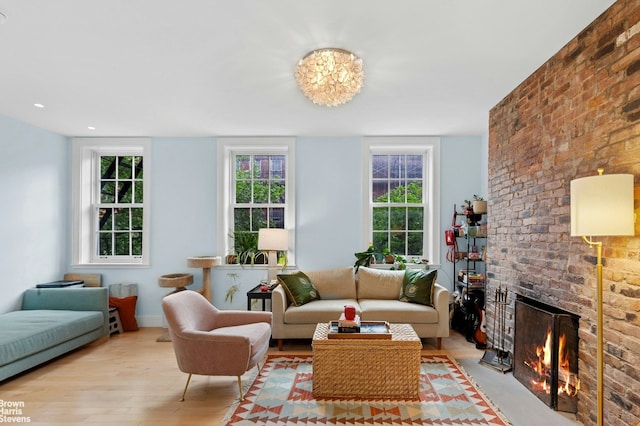 living room featuring wood finished floors and a fireplace