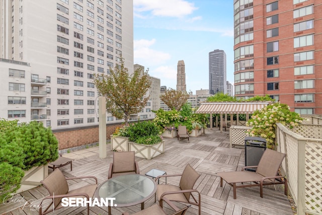 301 E 63rd St Unit 3B, New York City, NY 10065 - wooden deck featuring a city view