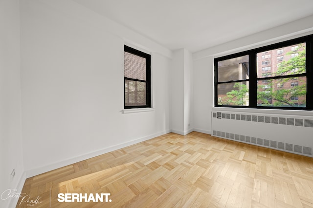301 E 63rd St Unit 3B, New York City, NY 10065 - unfurnished room featuring radiator heating unit and baseboards