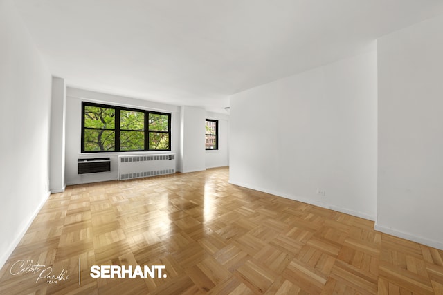 301 E 63rd St Unit 3C, New York City, NY 10065 - unfurnished room featuring radiator heating unit, baseboards, and healthy amount of natural light
