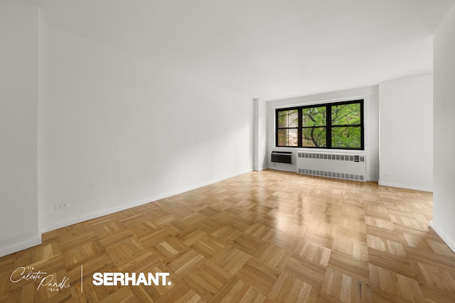 301 E 63rd St Unit 3C, New York City, NY 10065 - spare room with radiator and baseboards