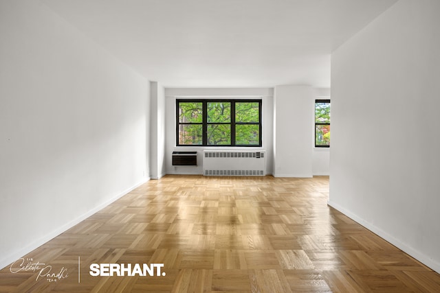 301 E 63rd St Unit 3C, New York City, NY 10065 - spare room featuring radiator heating unit, baseboards, plenty of natural light, and heating unit