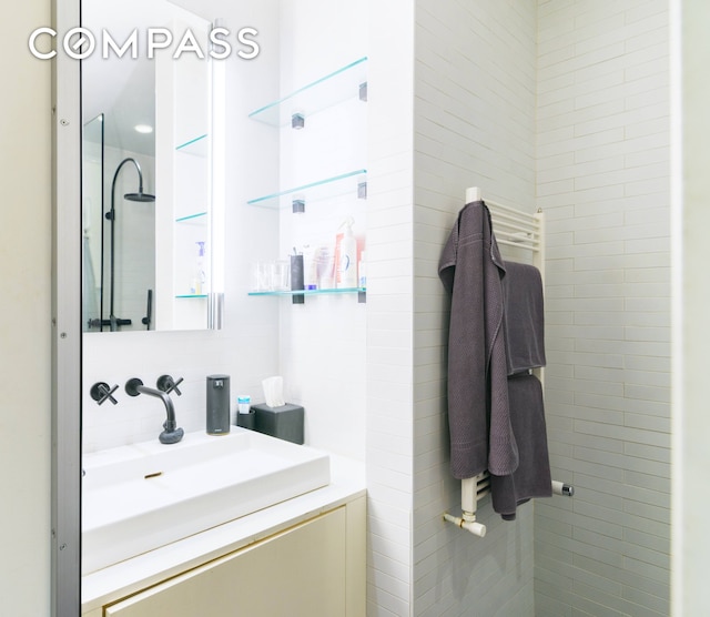 349 W 71st St, New York City, NY 10023 - bathroom with vanity and tile walls