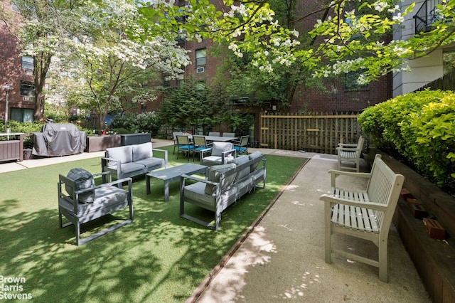 view of patio with a grill and outdoor lounge area