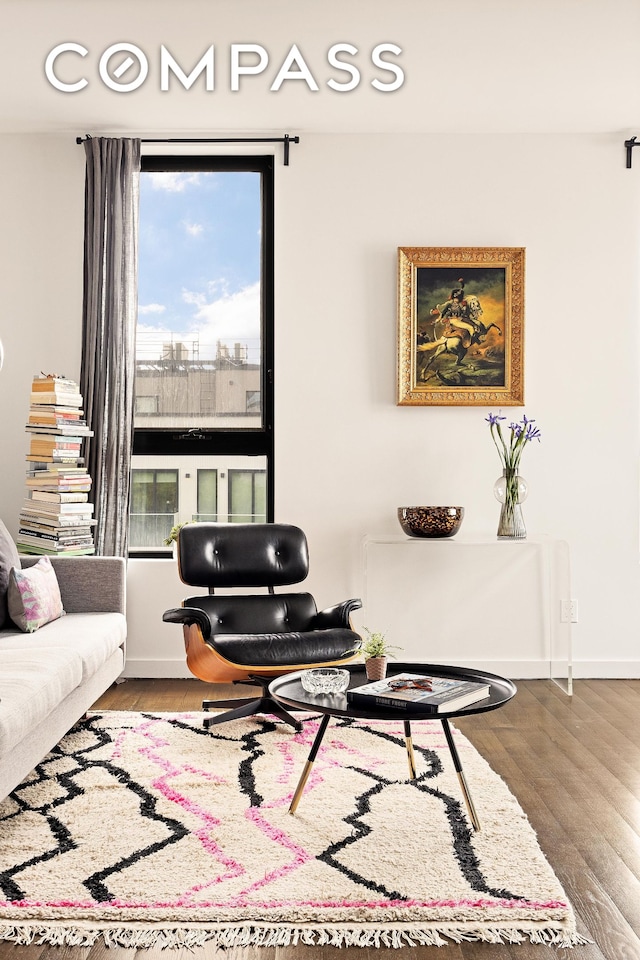 living room with wood finished floors and baseboards