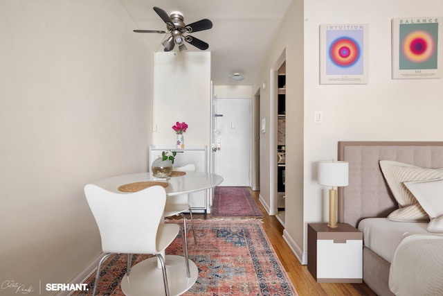 430 E 77th St Unit 4B, New York City, NY 10075 - dining room featuring wood finished floors, a ceiling fan, and baseboards