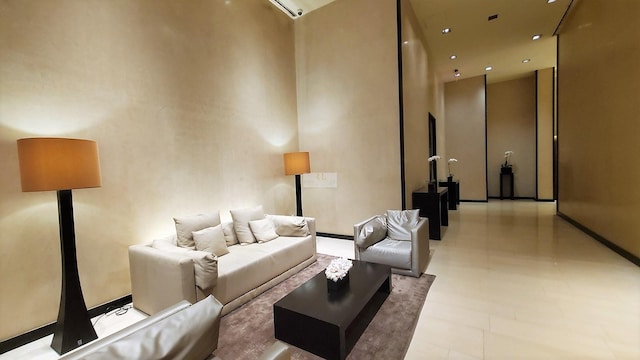 living area featuring baseboards