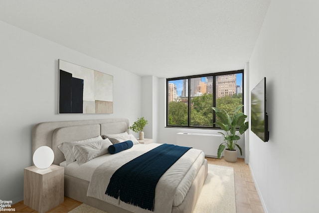 bedroom featuring baseboards