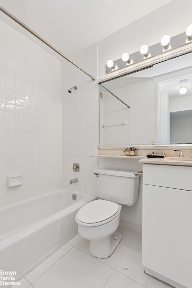 full bath featuring tile patterned flooring, toilet, bathing tub / shower combination, and vanity
