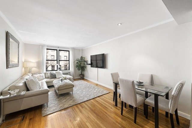 330 E 70th St Unit 2-H, New York City, NY 10021 - living room featuring wood finished floors, baseboards, and crown molding