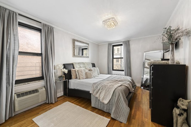 330 E 70th St Unit 2-H, New York City, NY 10021 - bedroom with crown molding, wood finished floors, and a wall mounted AC