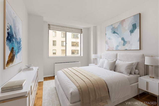 bedroom featuring radiator heating unit and baseboards