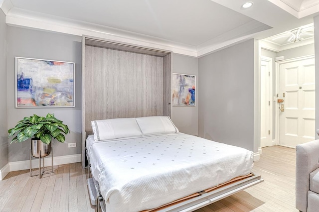 220 E 73rd St Unit 1-A, New York City, NY 10021 - bedroom with light wood-style floors, recessed lighting, and ornamental molding