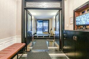 220 E 73rd St Unit 1-A, New York City, NY 10021 - hallway with a wainscoted wall