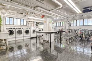 220 E 73rd St Unit 1-A, New York City, NY 10021 - communal laundry room with separate washer and dryer