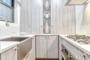 220 E 73rd St Unit 1-A, New York City, NY 10021 - kitchen with appliances with stainless steel finishes, light countertops, and a sink