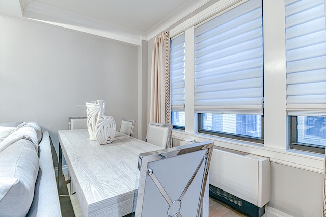 220 E 73rd St Unit 1-A, New York City, NY 10021 - dining area featuring ornamental molding and light wood-type flooring