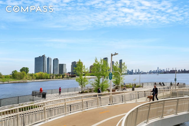 water view with a skyline view and fence