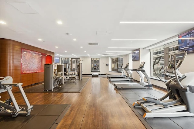 75 Wall St Unit Phl3, New York City, NY 10005 - gym featuring wood finished floors and recessed lighting