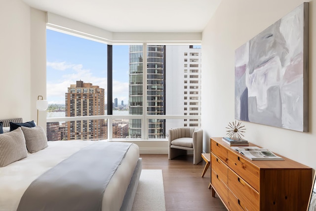 77 Greenwich St Unit 24-A, New York City, NY 10006 - bedroom featuring a view of city and wood finished floors