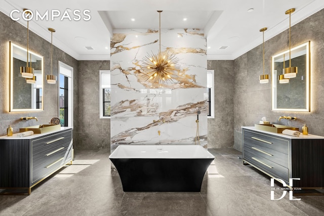 52 Nicolosi Loop, New York City, NY 10312 - full bathroom with a freestanding tub, tile walls, crown molding, and two vanities