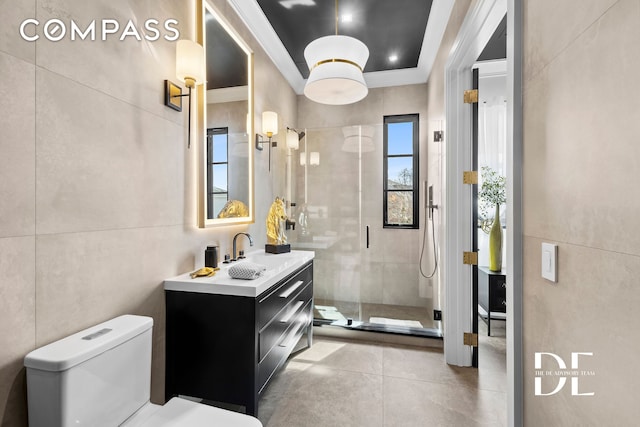 52 Nicolosi Loop, New York City, NY 10312 - full bathroom with vanity, a shower stall, tile walls, and crown molding