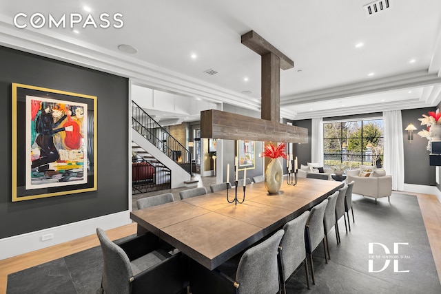 dining space featuring wood finished floors, baseboards, recessed lighting, and stairway