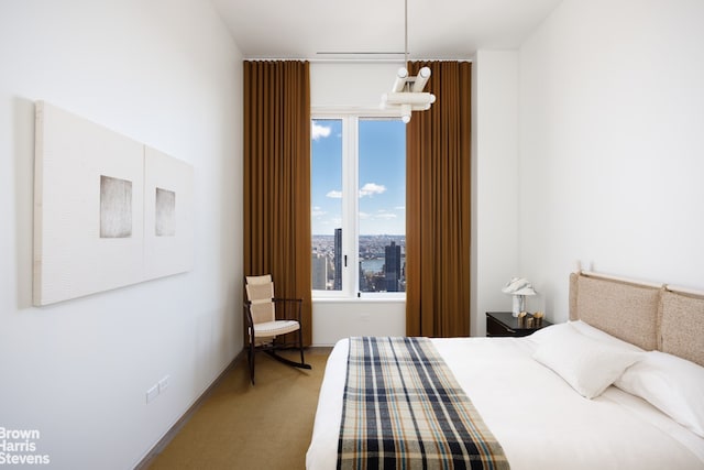 bedroom featuring light colored carpet