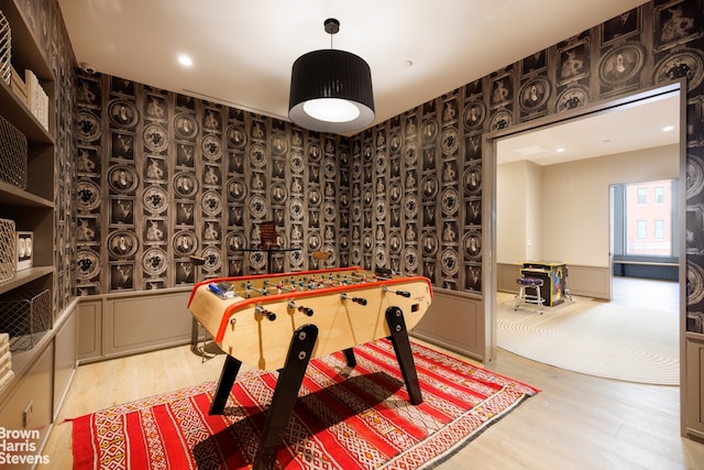 game room with wood finished floors and recessed lighting